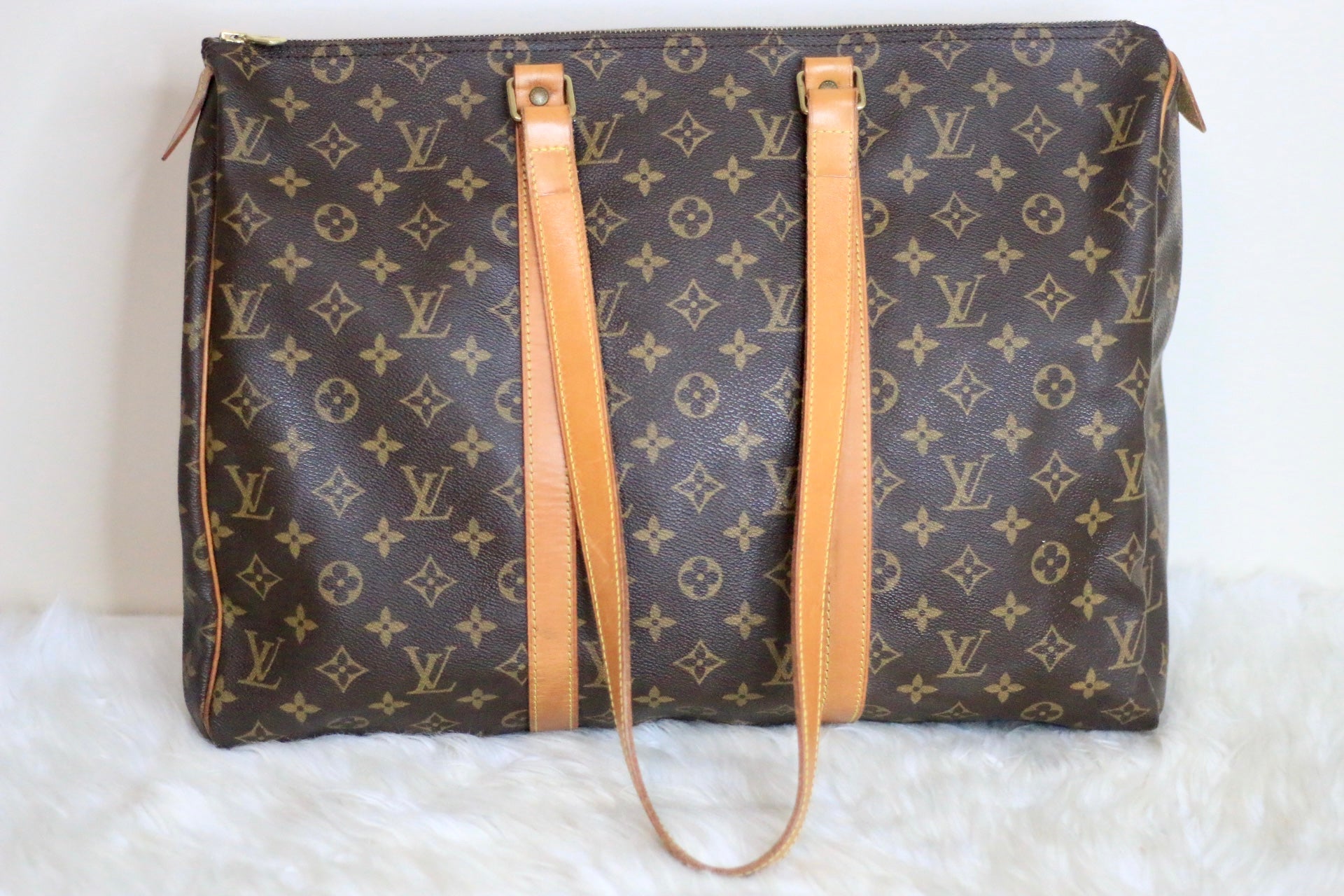 Louis Vuitton Flanerie in monogram canvas and natural leather