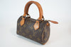 Louis Vuitton Monogram Mini Speedy HL w/ strap Used